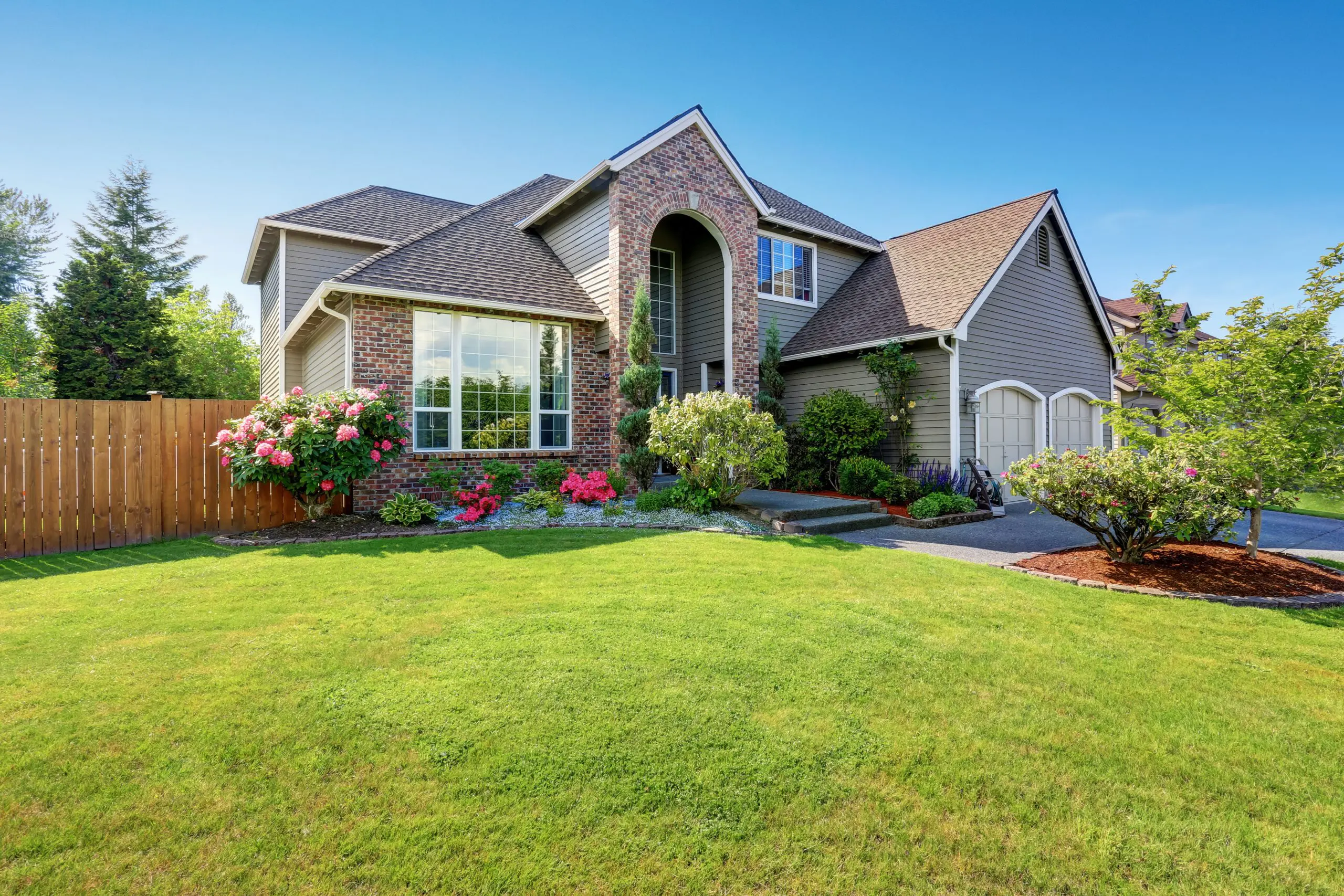 Luxury house exterior with brick and siding trim