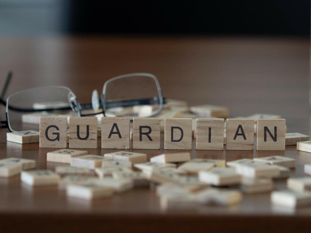 Guardian word or concept represented by wooden letter tiles