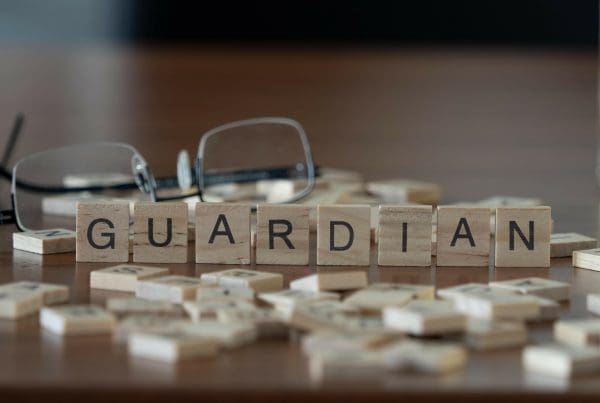 Guardian word or concept represented by wooden letter tiles